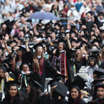 Graduates cheering in audience